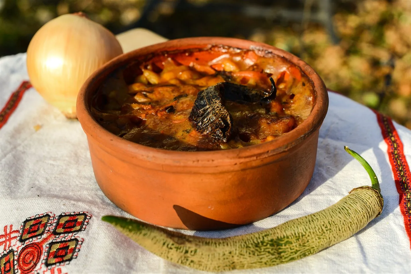 Tavče gravče baked and served in a clay dish