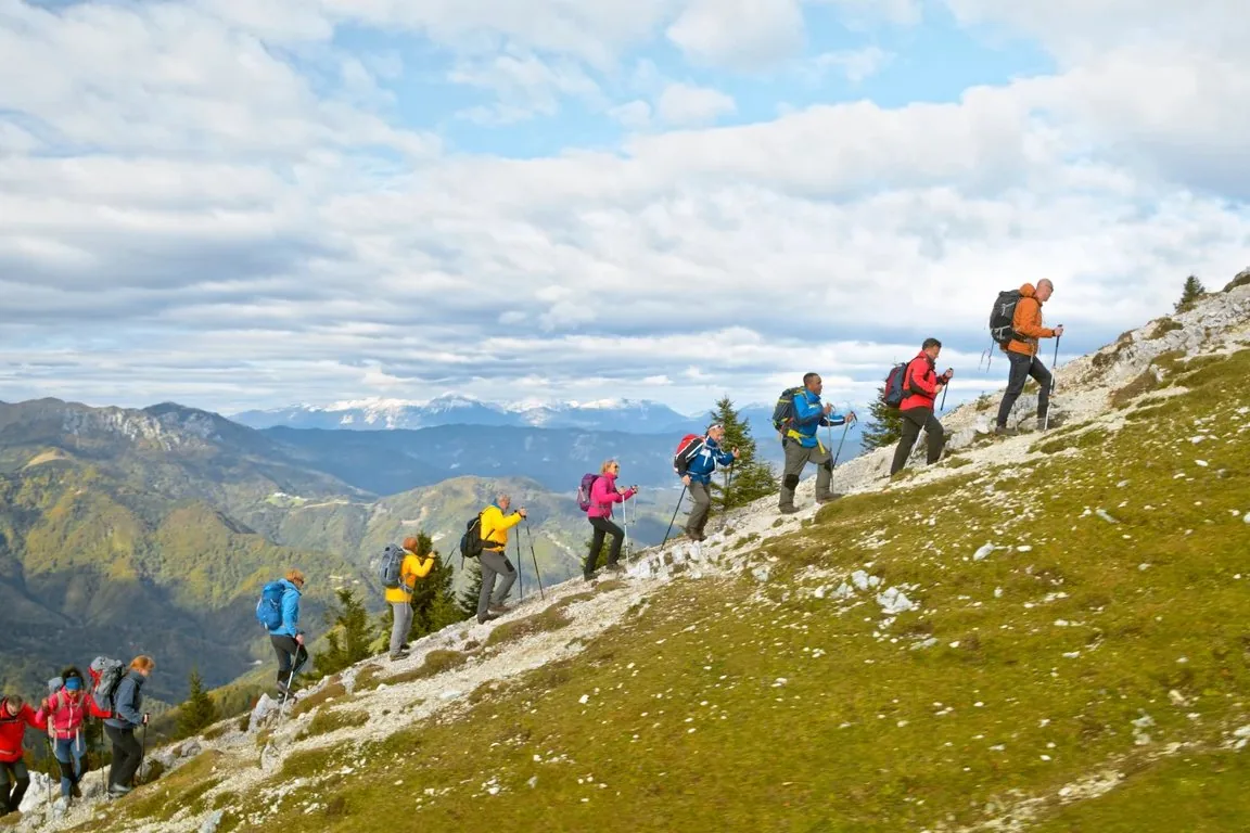 Hikers on a mountain path in Slovenia