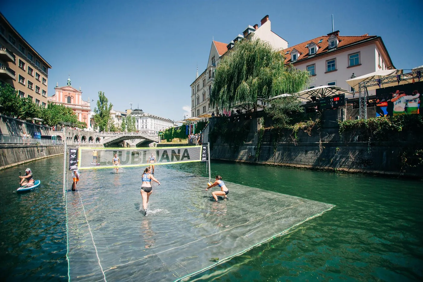 A crowd gathered along the Ljubljanica during an event in central Ljubljana